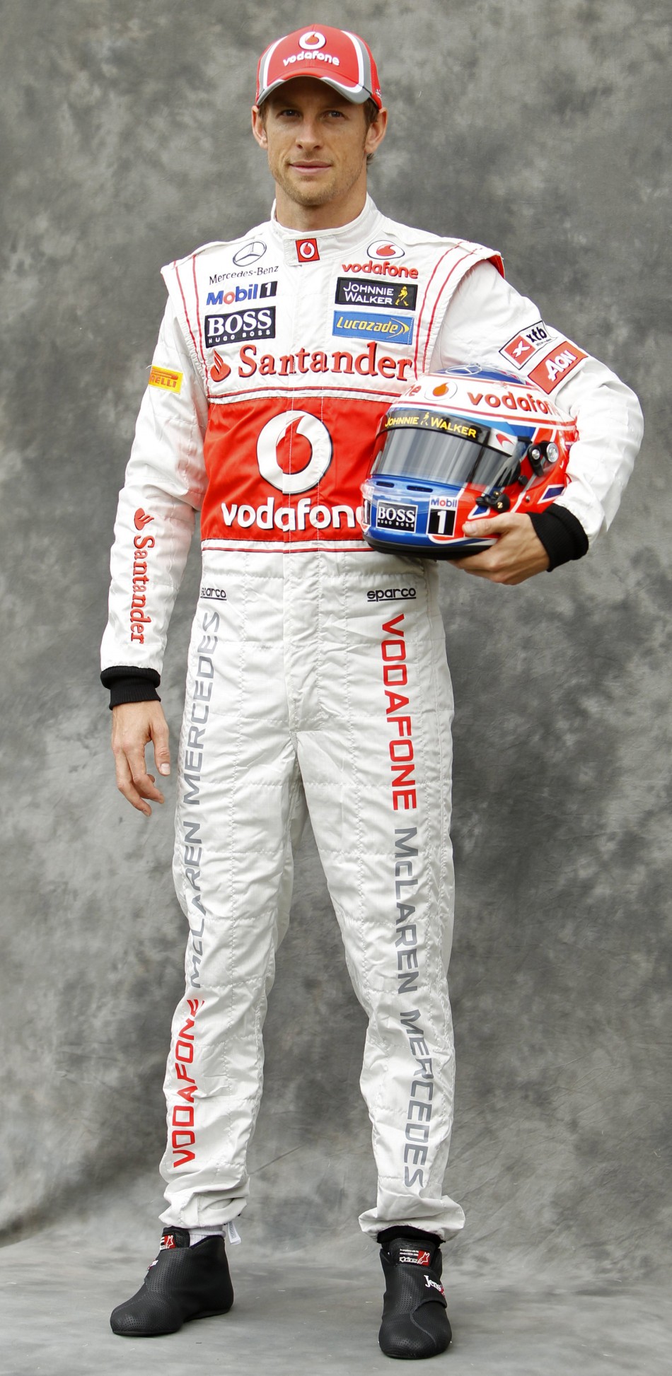 McLaren Formula One driver Button poses prior to the Australian F1 Grand Prix at the Albert Park circuit in Melbourne