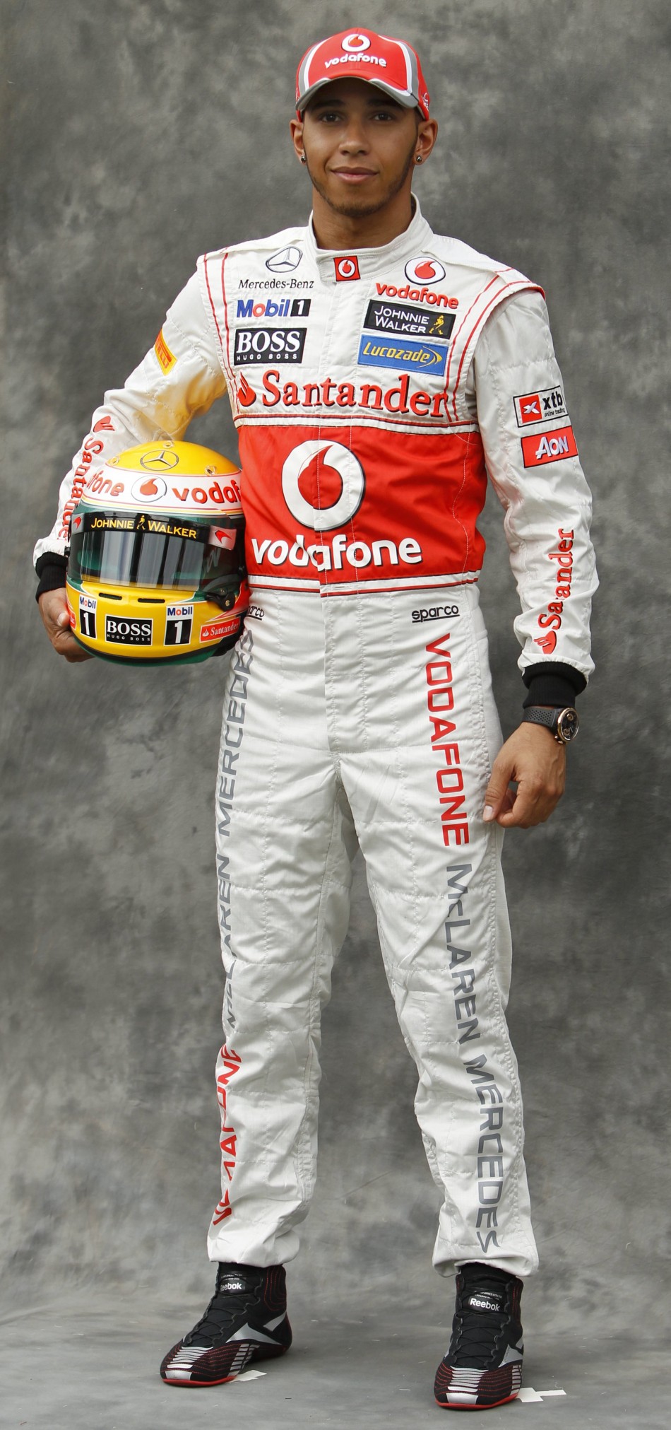 McLaren Formula One driver Hamilton poses prior to the Australian F1 Grand Prix at the Albert Park circuit in Melbourne