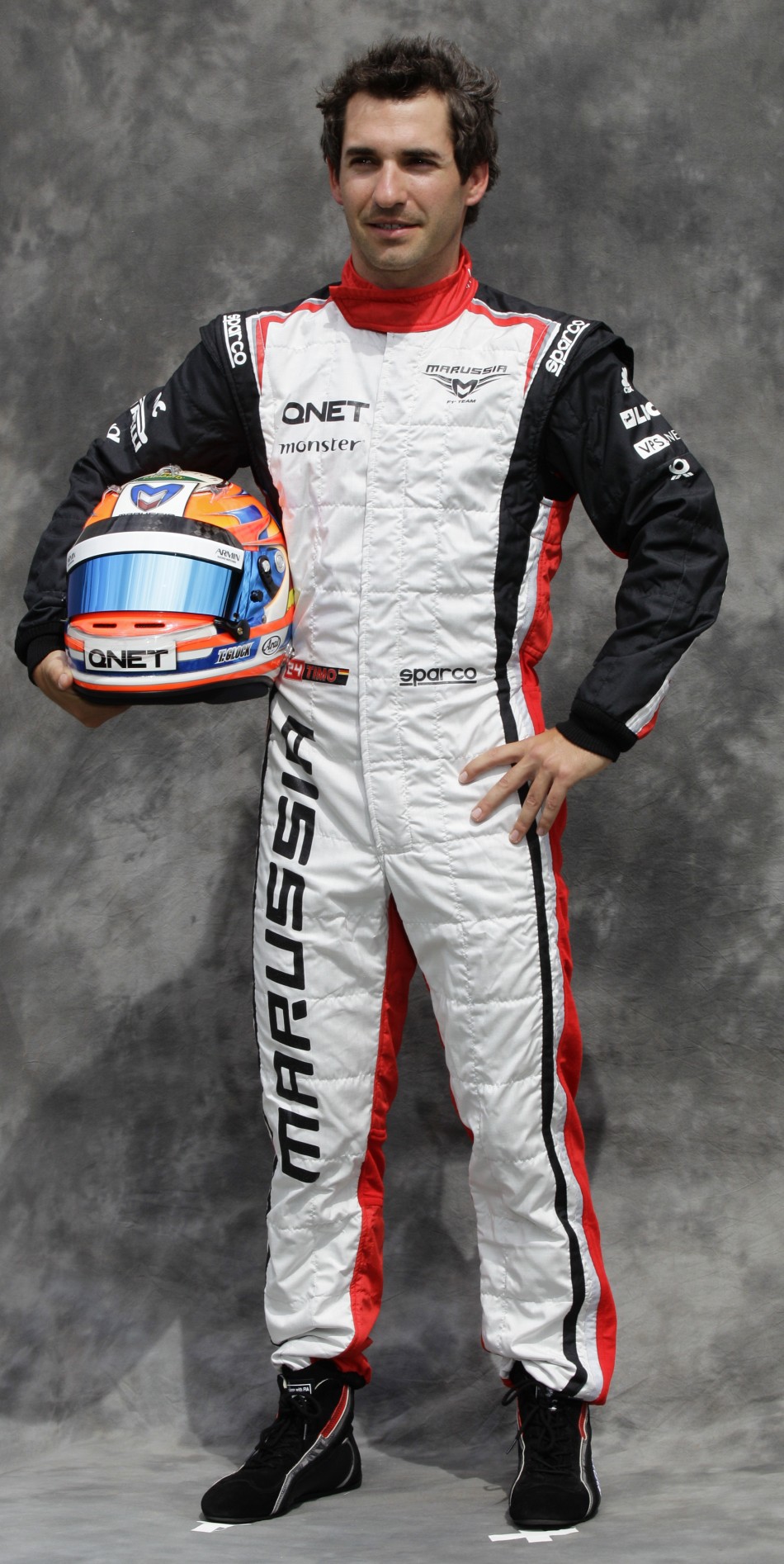 Marussia Formula One driver Glock poses prior to the Australian F1 Grand Prix at the Albert Park circuit in Melbourne