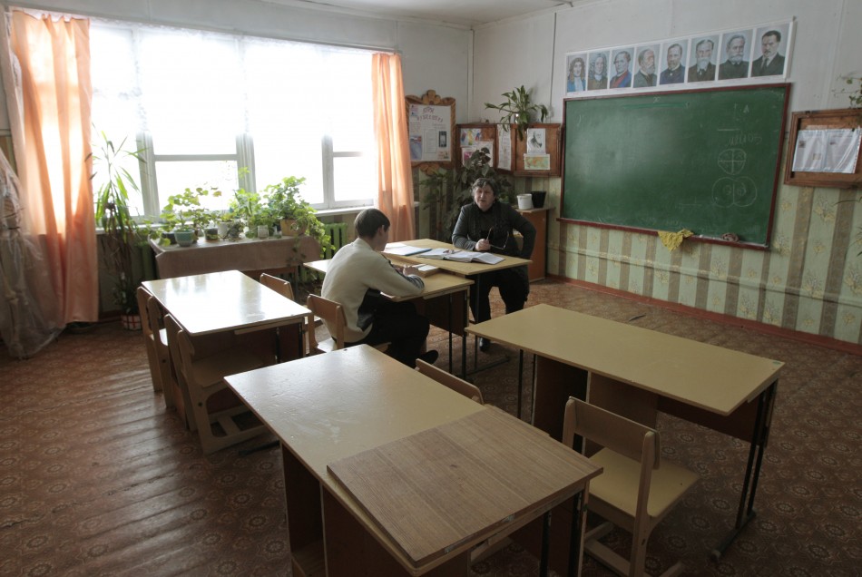 A ninth-grade pupil attends a Russian literature lesson at a school in the remote Russian village of Bolshie Khutora