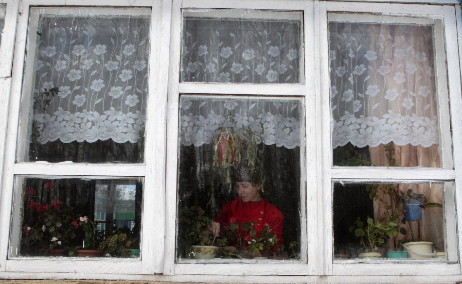 Andronake, a seventh grade pupil, looks after plants at a school based in the remote Russian village of Bolshie Khutora