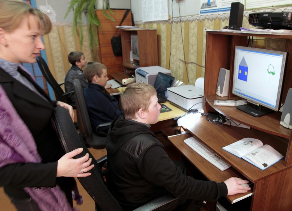 Pupils attend an informatics lesson at a school based in the remote Russian village of Bolshie Khutora