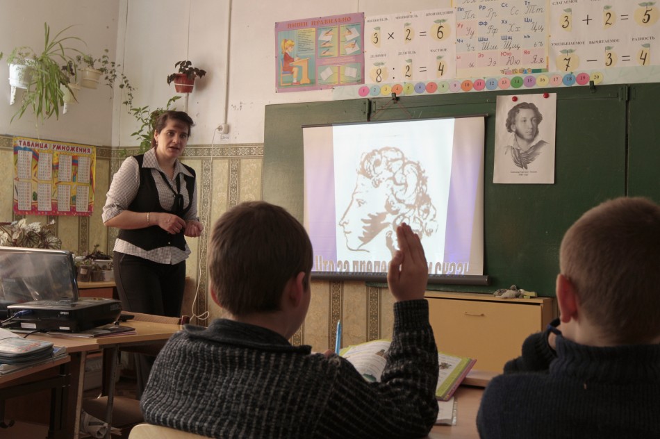Fourth and fifth grade pupils attend a Russian language lesson at a school in the remote Russian village of Bolshie Khutora