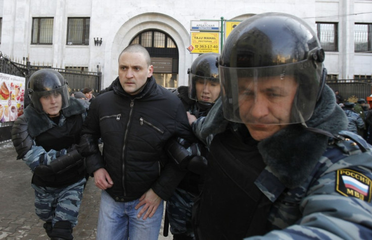 Riot police detain Left Front movement leader Sergei Udaltsov during demonstration for fair elections in central Moscow