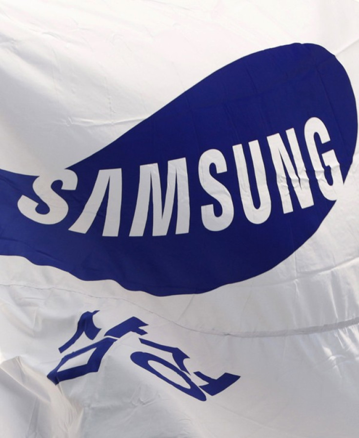 Flag of Samsung flutters in the wind at the company&#039;s main office building in Seoul
