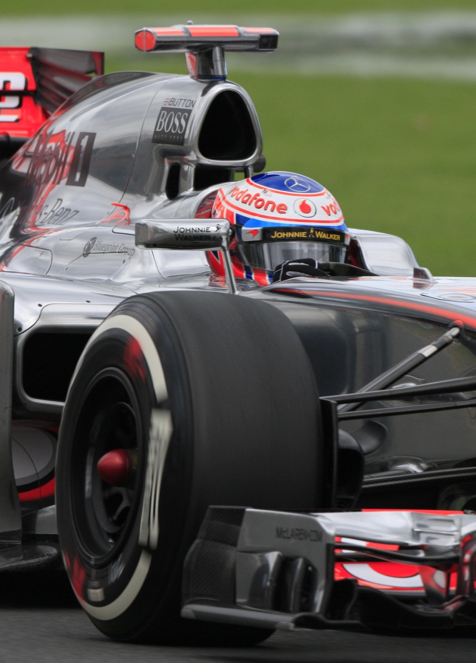 McLaren Formula One driver Button drives during the first practice session of the Australian F1 Grand Prix at the Albert Park circuit in Melbourne