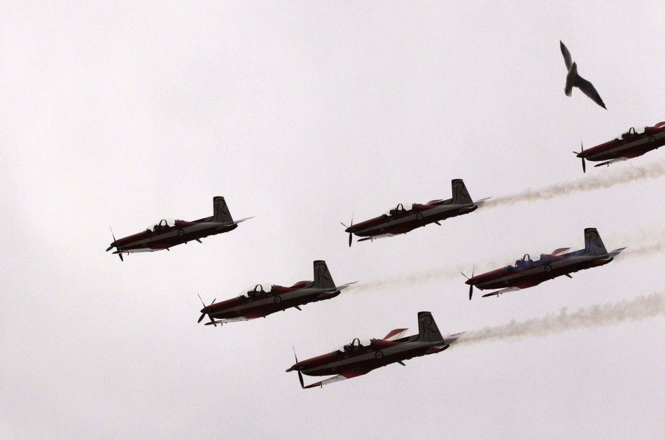 The Royal Australian Air Force aerobatic team, The Roulettes, perform over the Albert Park circuit before the first practice session of the Australian F1 Grand Prix in Melbourne