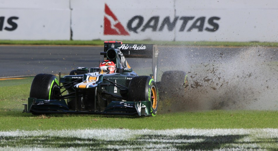 Caterham Formula One driver Kovalainen drives on the grass during the second practice session of the Australian F1 Grand Prix at the Albert Park circuit in Melbourne