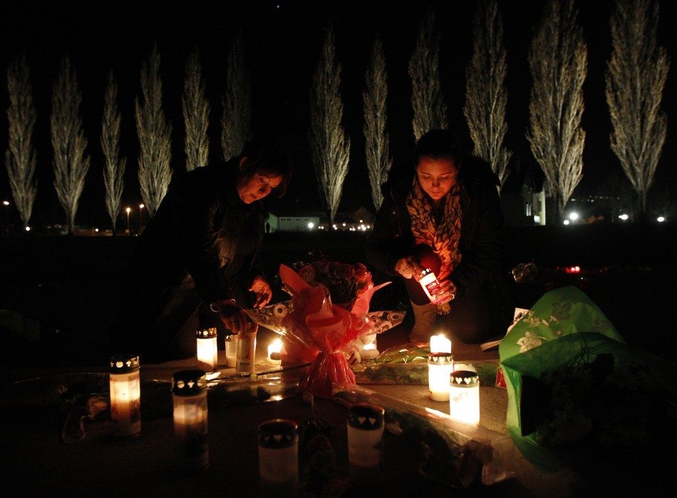 People pay tribute to the victims of a bus crash in Sierre