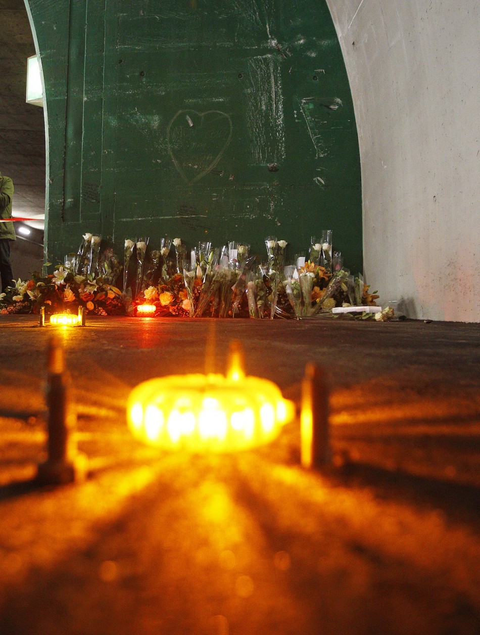 Candles and flowers are seen at the scene of an accident inside the Tunnel de Sierre during a news conference in Sierre