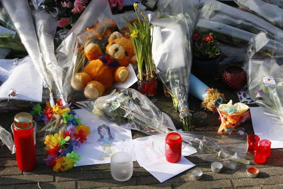 Flowers and other tributes are seen in front of the t Stekske school in Lommel