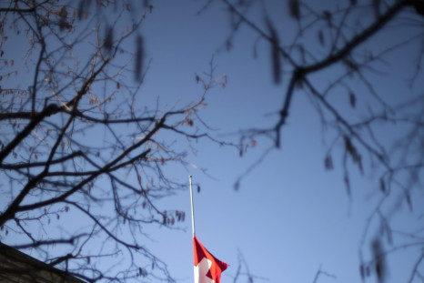 A Swiss flag flies at half-mast outside the building of the Swiss Foreign Department in Bern