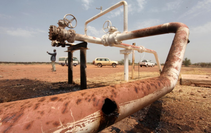 Oil spills onto the ground from an oil well head strafed by shrapnel from a bomb dropped by fighter jets at the El Nar oil field in South Sudan's Unity State Oil spills onto the ground from an oil well head strafed by shrapnel from a bomb dropped by fighter jets at the El Nar oil field in South Sudan's Unity State