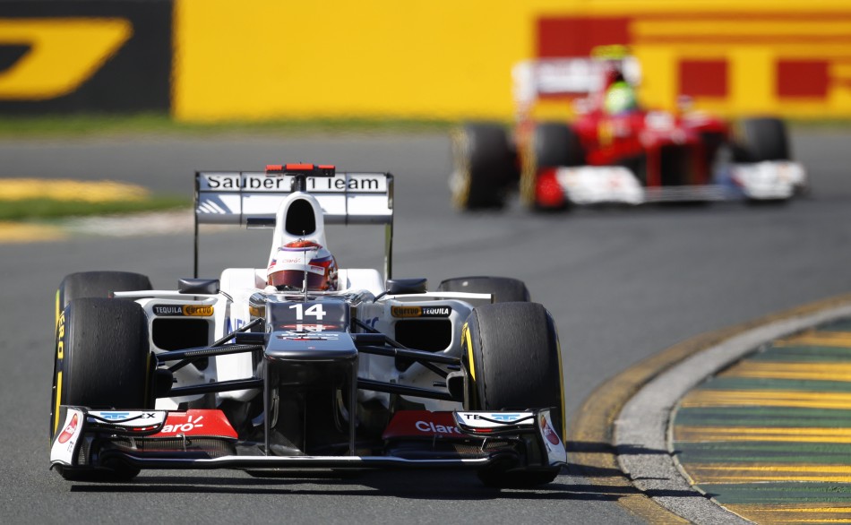 Saubers Kobayashi drives ahead of Ferraris Massa during the third practice session of the Australian F1 Grand Prix at the Albert Park circuit in Melbourne