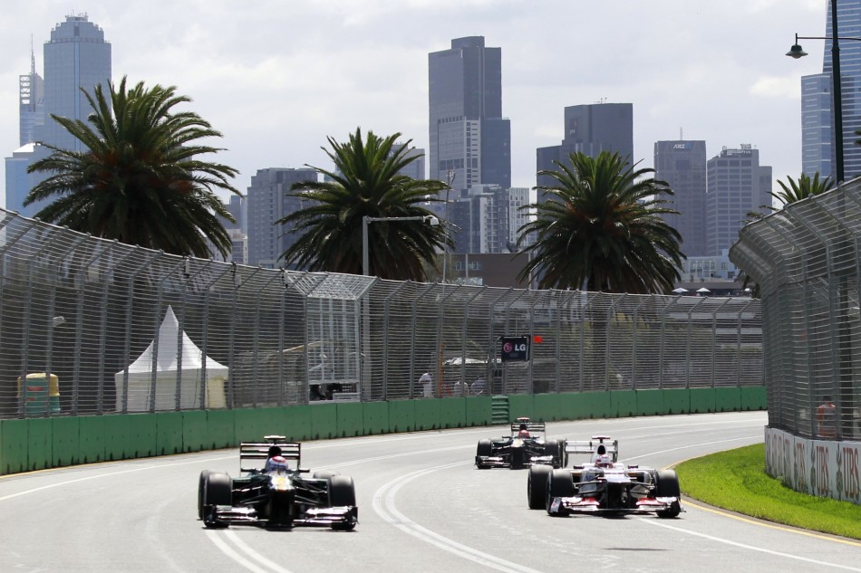 Caterhams Petrov and Kovalainen and Saubers Kobayashi drive during the third practice session of the Australian F1 Grand Prix at the Albert Park circuit in Melbourne