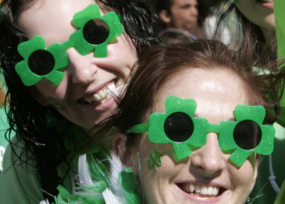 Irish women wear clover-shaped sunglasses as they watch a parade in Tokyo