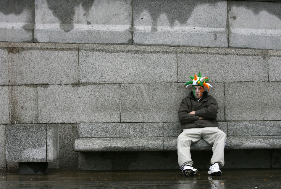 A man sits down during St Patricks day celebrations in Trafalgar Square in central Londo