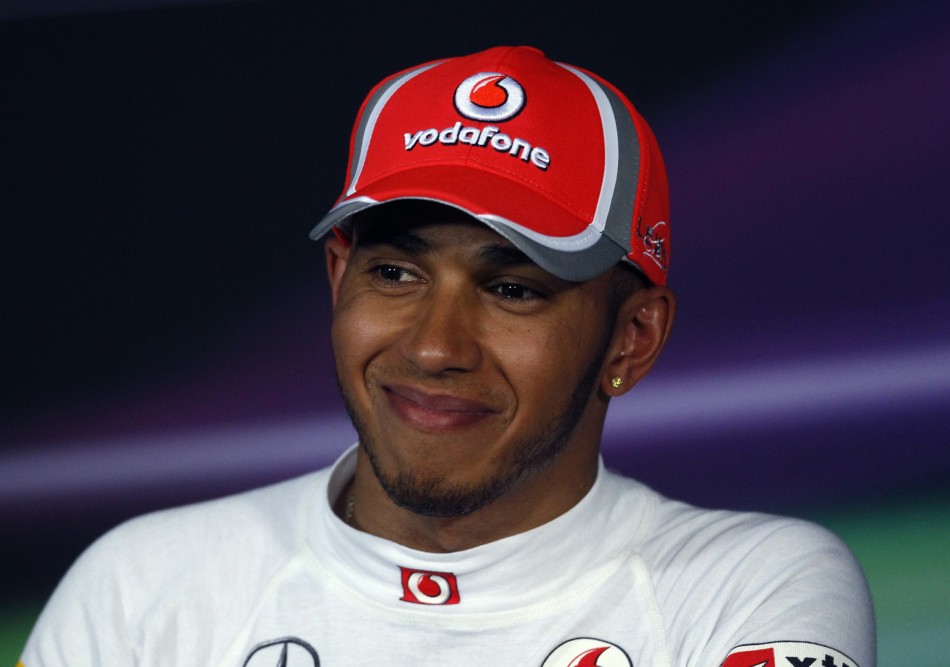 McLaren Formula One driver Hamilton smiles during the post-qualifying news conference of the Australian F1 Grand Prix at the Albert Park circuit in Melbourne
