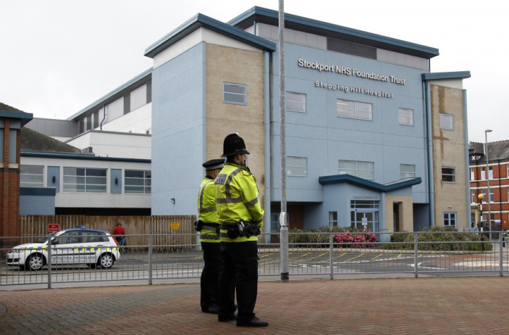 Police Officers standing outside Steppington Hospital.