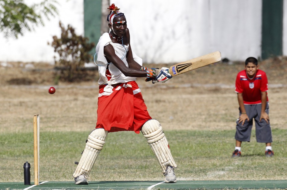 Njayo Takare of the Maasai Cricket Warriors plays a shot against the Jafferys team during their friendly match in the Kenyan coastal city of Mombasa