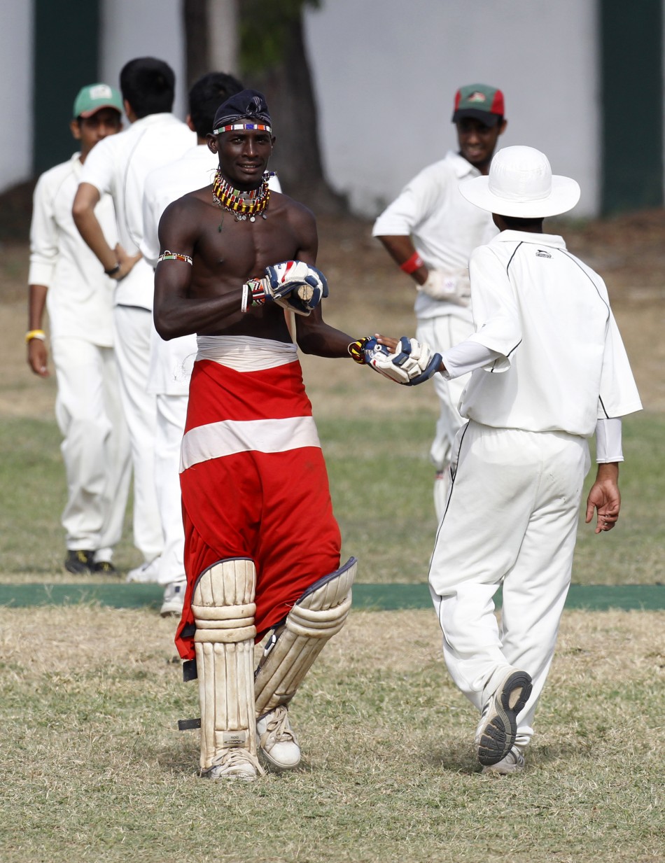 Ole Ngais, captain of the Maasai Cricket Warriors, leaves the field after he was dismissed in Mombasa