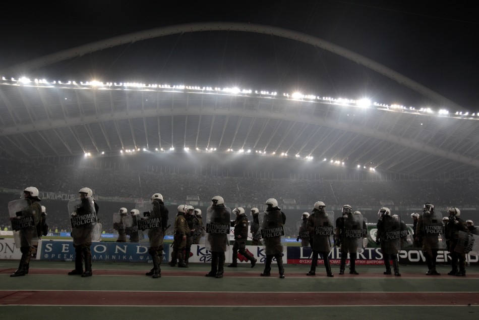 Riot police secure the pitch