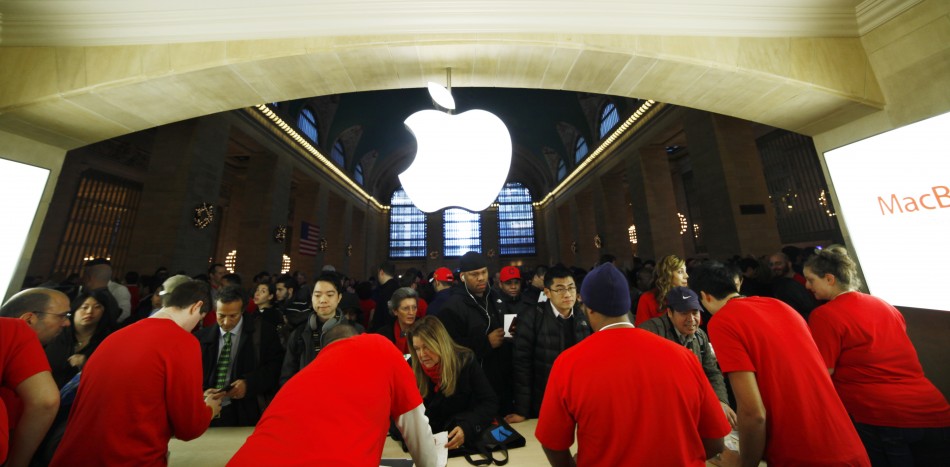 Customers buy Apple products inside the newest Apple Store during its opening on the East Balcony in the main lobby of New York Citys Grand Central Station