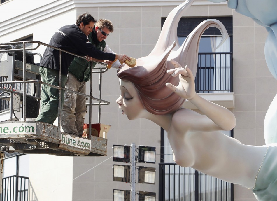 Craftsmen puts finishing touches on a giant figure ahead of the quotFallasquot festival in Valencia
