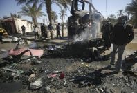 Residents gather at site of bomb attack in Kerbala
