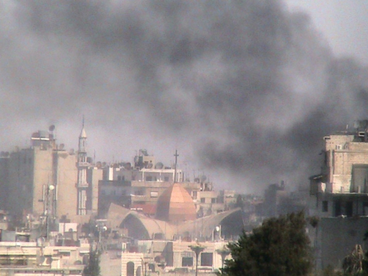 Smoke rises from Bab Sabaa neighbourhood of Homs