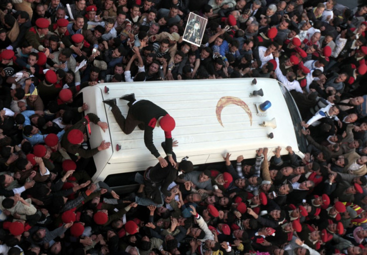 Military police restrain mourners for funeral of Pope Shenouda III