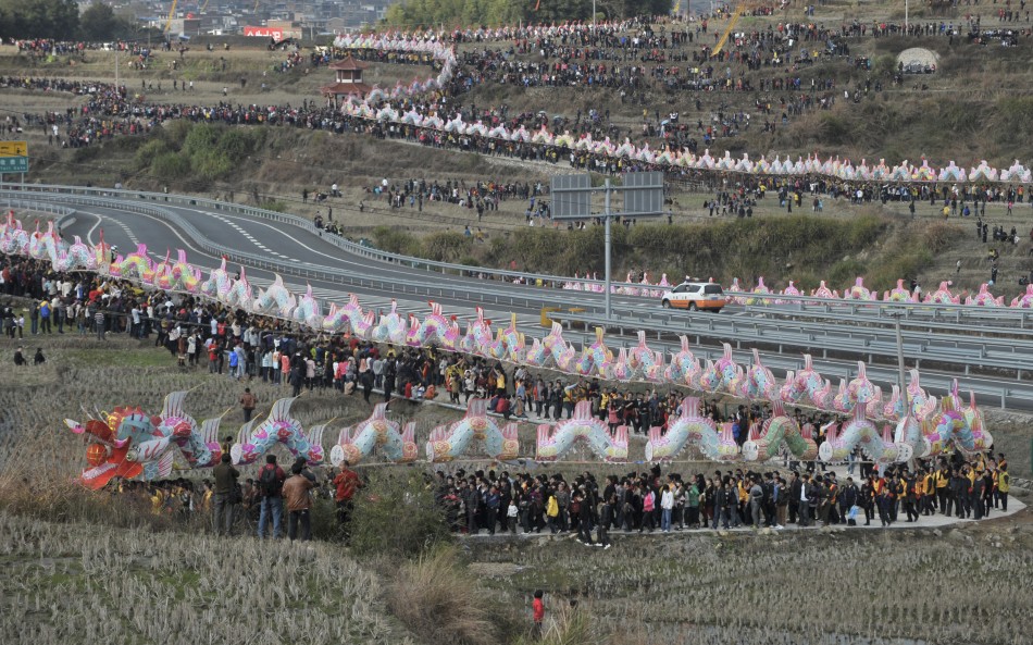 Villagers perform the annual dragon march