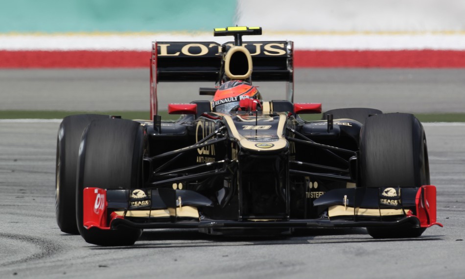 Lotus F1 Formula One driver Raikkonen drives during the first practice session of the Malaysian F1 Grand Prix at Sepang International Circuit outside Kuala Lumpur