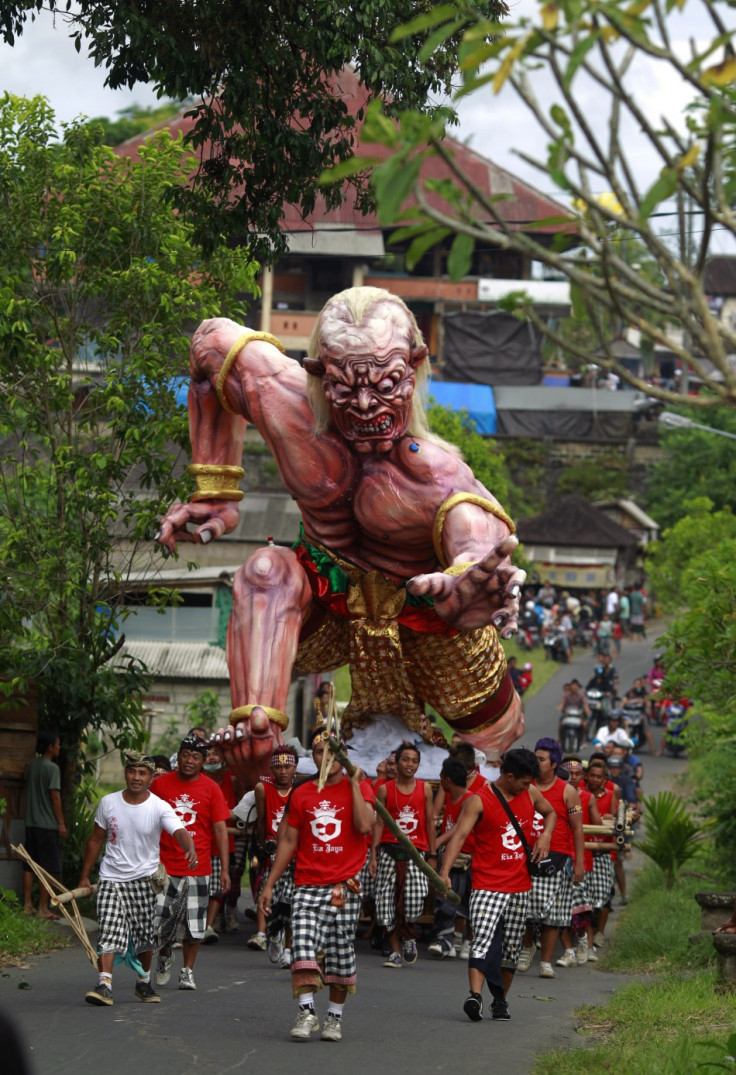 alinese carry an Ogoh-ogoh effigy during a ritual ahead of Nyepi day in Ubud Gianyar, Bali