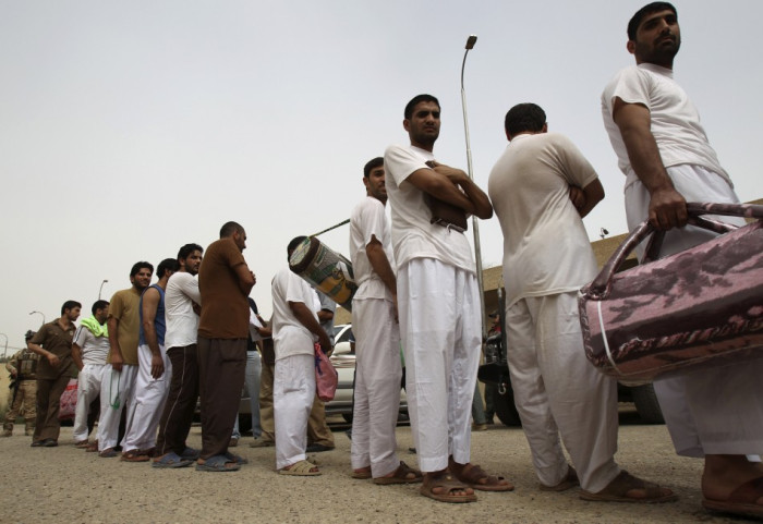 Detainees queue up as they are processed for release at al-Rusafa prison in Baghdad Detainees queue up as they are processed for release at al-Rusafa prison in Baghdad