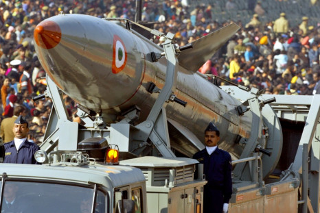 Indian soldiers stand beside India's surface-to-surface missile Agni 2 in New Delhi