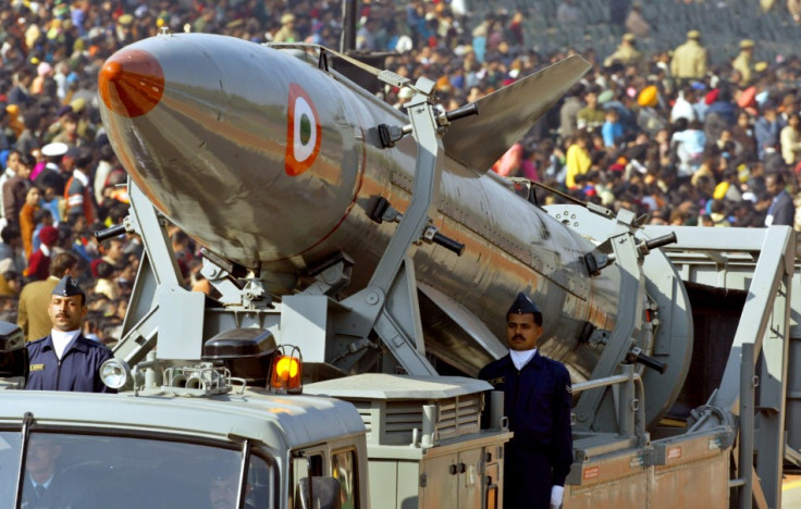 Indian soldiers stand beside India's surface-to-surface missile Agni 2 in New Delhi