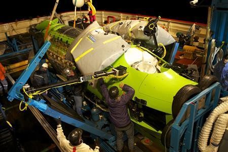 Crews prepare the Deepsea Challenger for its first test in the ocean at Jervis Bay, south of Sydney