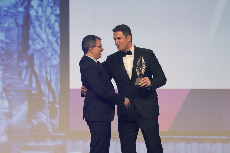 Journalist Thomas Roberts presents Chris Geidner an award for Outstanding Magazine Article at the 23rd annual GLAAD Media Awards in New York