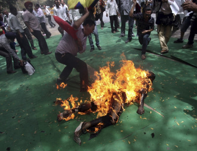 Other Tibetans tried to extinguish flames