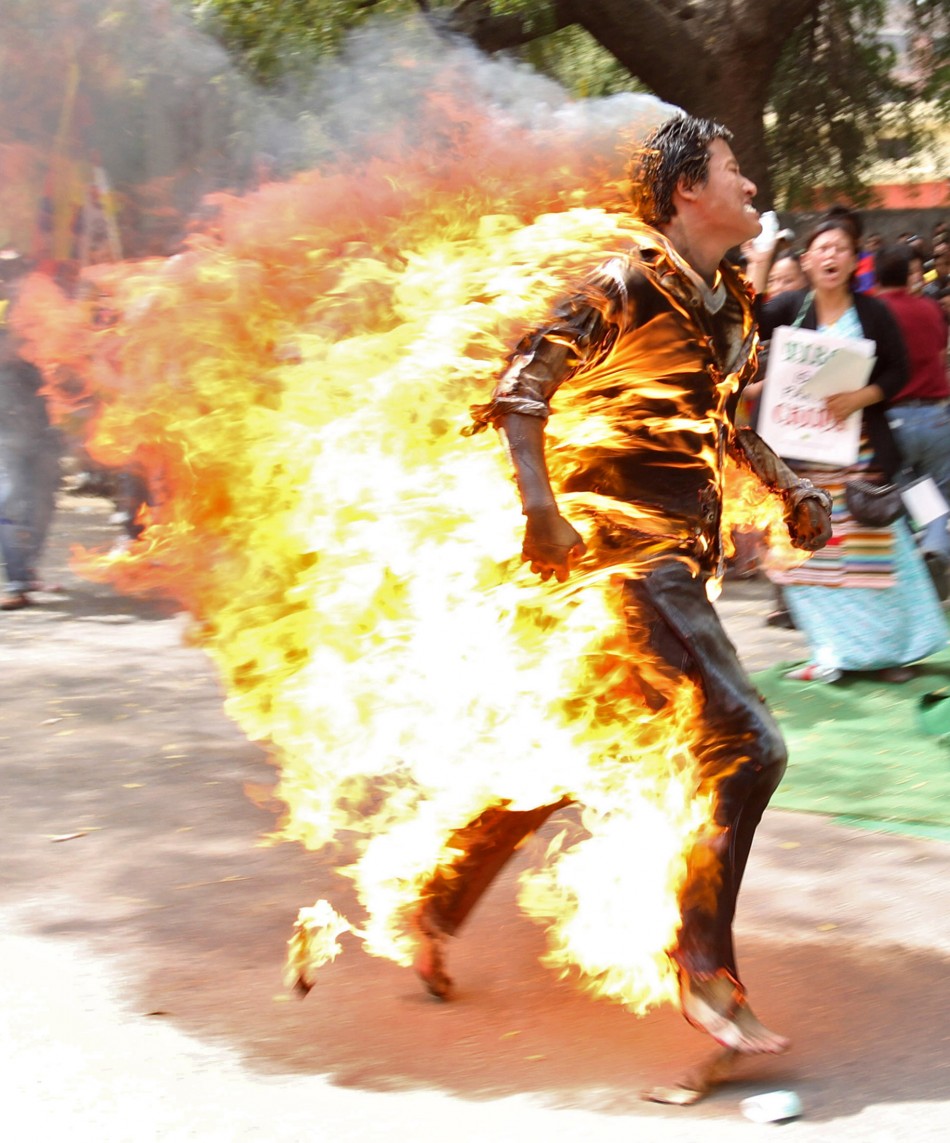 Tibetan exile ran by speakers at rally in New Delhi after self-immolating in protest over upcoming visit by Chinese President Hu Jintao