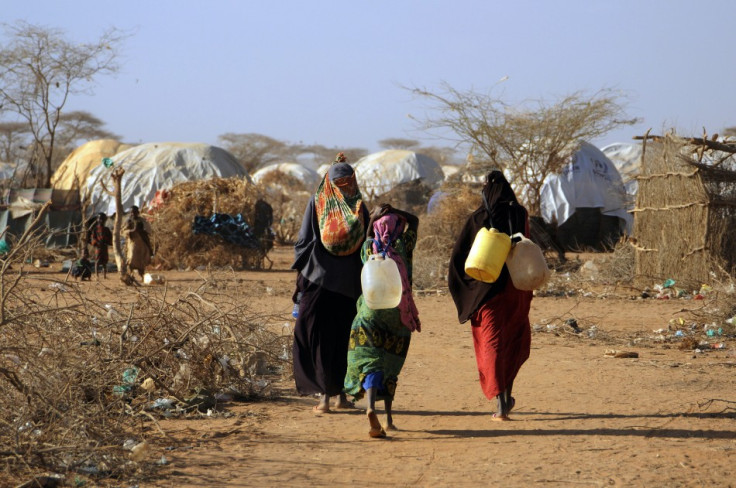 Malian women fetch water from communal tap in Kenya's Dadaab refugee camp