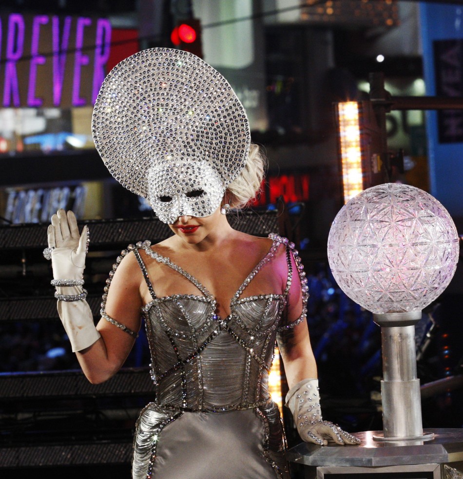 Singer Lady Gaga waves to the crowd as she arrives to activate the New Years Eve ball during celebrations at Times Square in New York