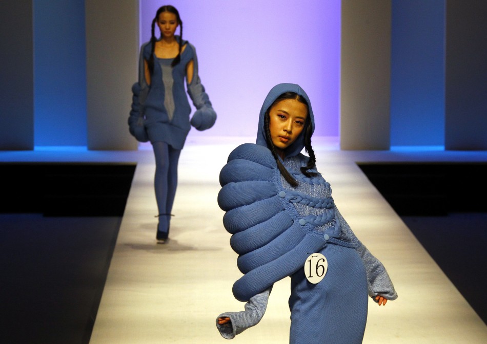 Models present creations at the 2012 China Knitwear Fashion design contest show during China Fashion Week in Beijing
