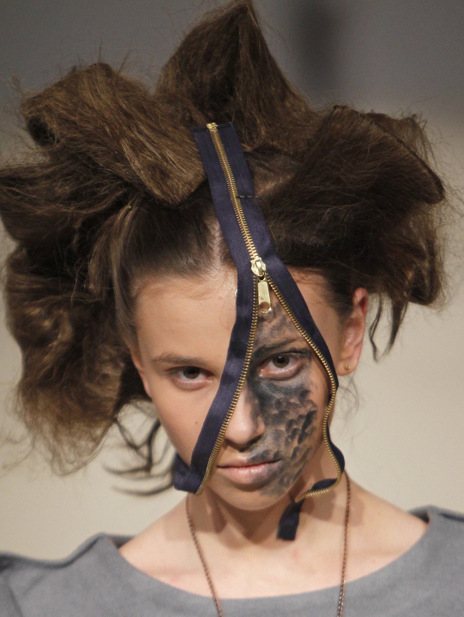A model presents a creation by Ukrainian designer Liudmyla Komardina during Ukrainian Fashion Week in Kiev