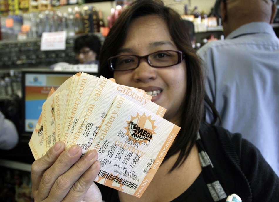 Veronica Balbas holds her Mega Millions lottery tickets for Fridays draw in Lawndale