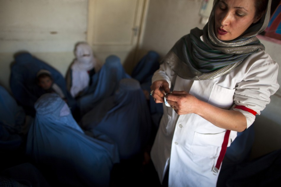 An Afghan doctor explains the use of condoms to a group of women addicts at a counseling session at the Nejat drug rehabilitation centre, an organisation funded by the United Nations providing harm reduction and HIVAIDS awareness, in Kabul