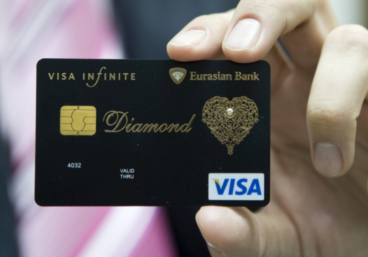 Dmitry Nikolin, the Executive Director of Eurasian Bank, shows a new VISA card encrusted with a 0.02 carat diamond and laced with an elaborate gold pattern in Almaty December 23, 2008. Dmitry Nikolin, the Executive Director of Eurasian Bank, shows a new VISA card encrusted with a 0.02 carat diamond and laced with an elaborate gold pattern in Almaty December 23, 2008.