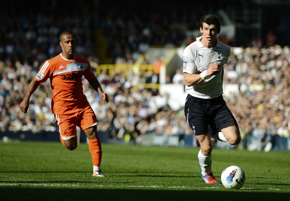 Tottenham Hotspur039s Gareth Bale runs away from Swansea City039s Scott Sinclair during their English Premier League soccer match in London