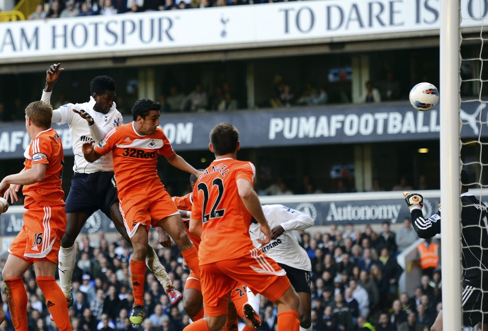 Tottenham Hotspur039s Emmanuel Adebayor rises above the Swansea City defence to score a header during ttheir English Premier League soccer match in London